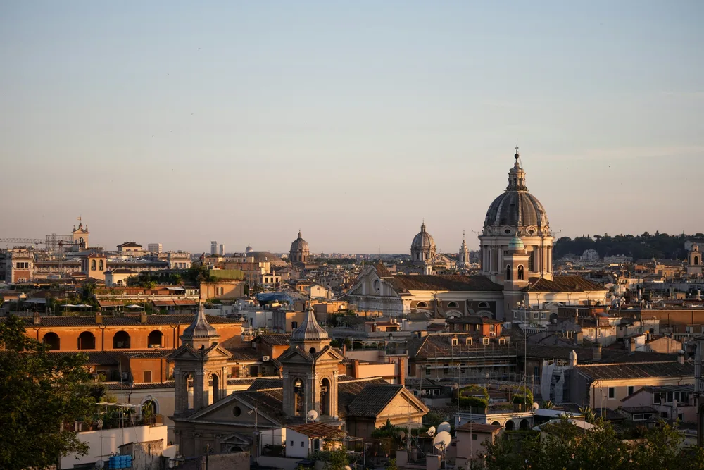 Rooftops, domes and bell towers of central Rome at golden hour